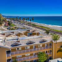 Beachfront Inn - View from behind with the ocean in the background